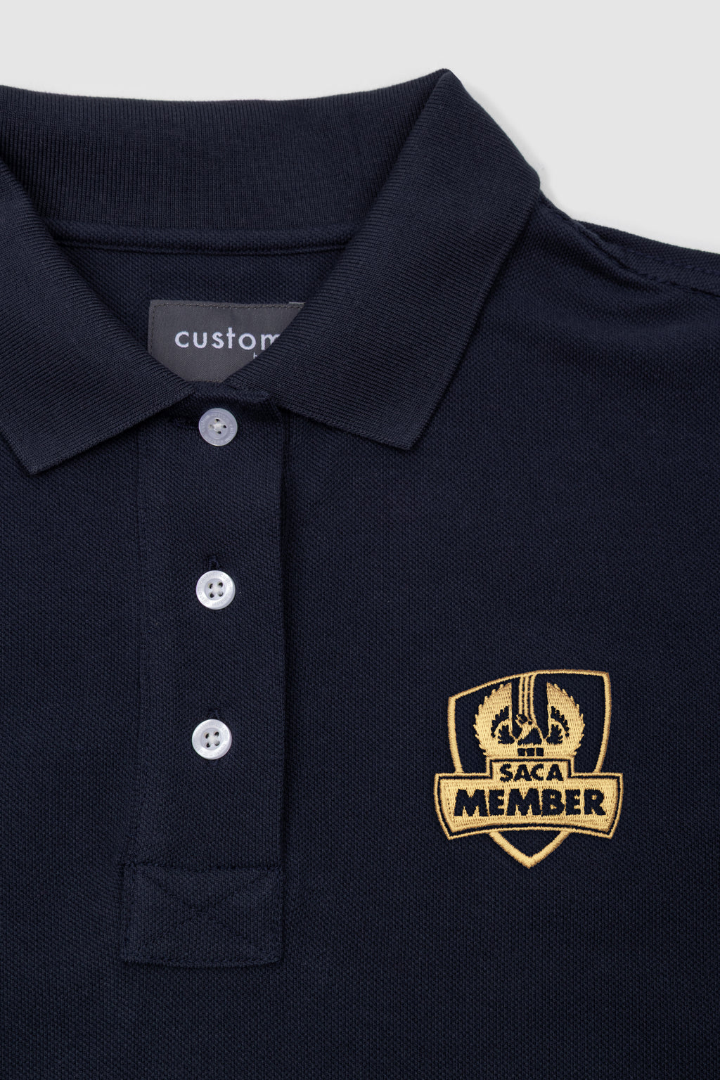 Saca Merchandise Womens Polo Shirt Navy & Gold Emblem – SACA Merchandise